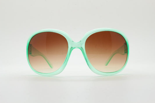 Y2k vintage oversized womens sunglasses. Big and bold 70s design in a transparent green frame with well matched brown lenses. Rave 2000s