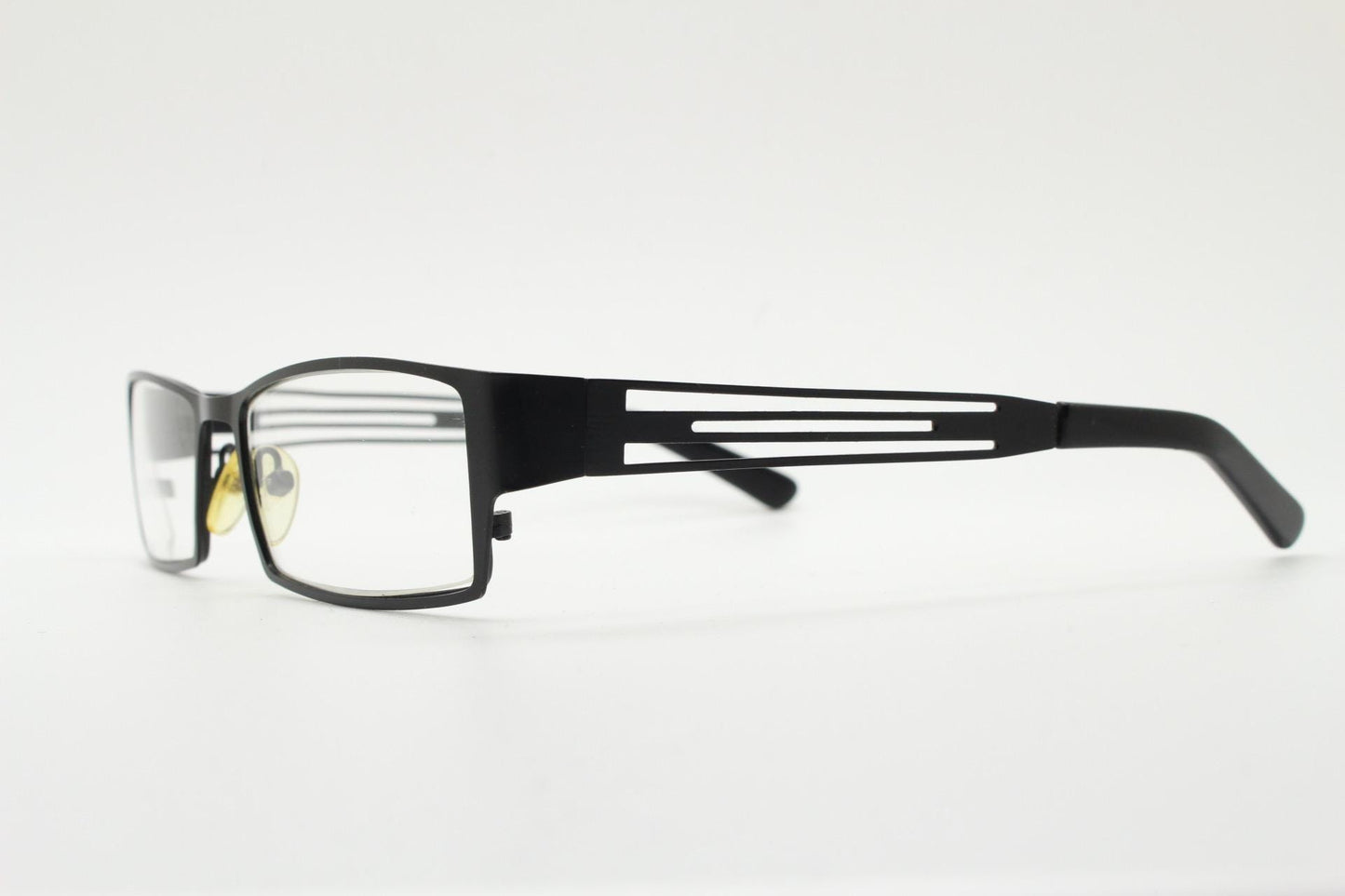 Police 90s vintage rectangular eye glasses model 023. Solid metal optical frame in black satin finish with cut out arm stripes. Prescription