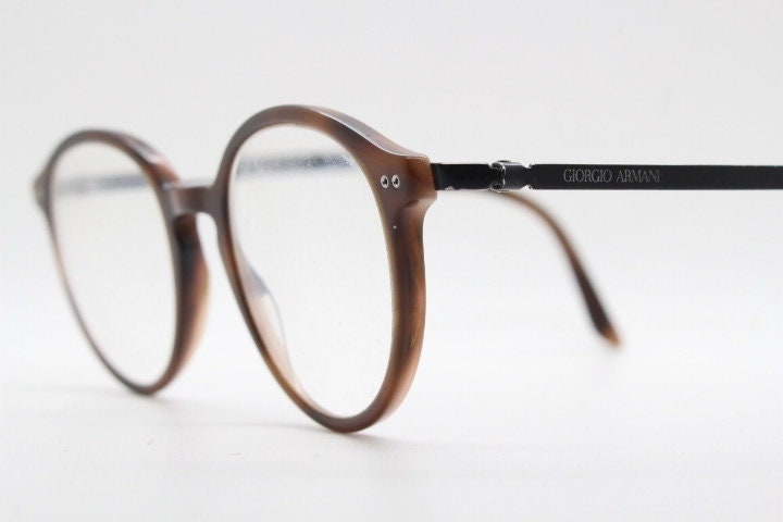Giorgio Armani eye glasses model 7124 made in Italy. Mottled brown acetate optical frames with flat metal arms. Prescription eyeglasses. RX