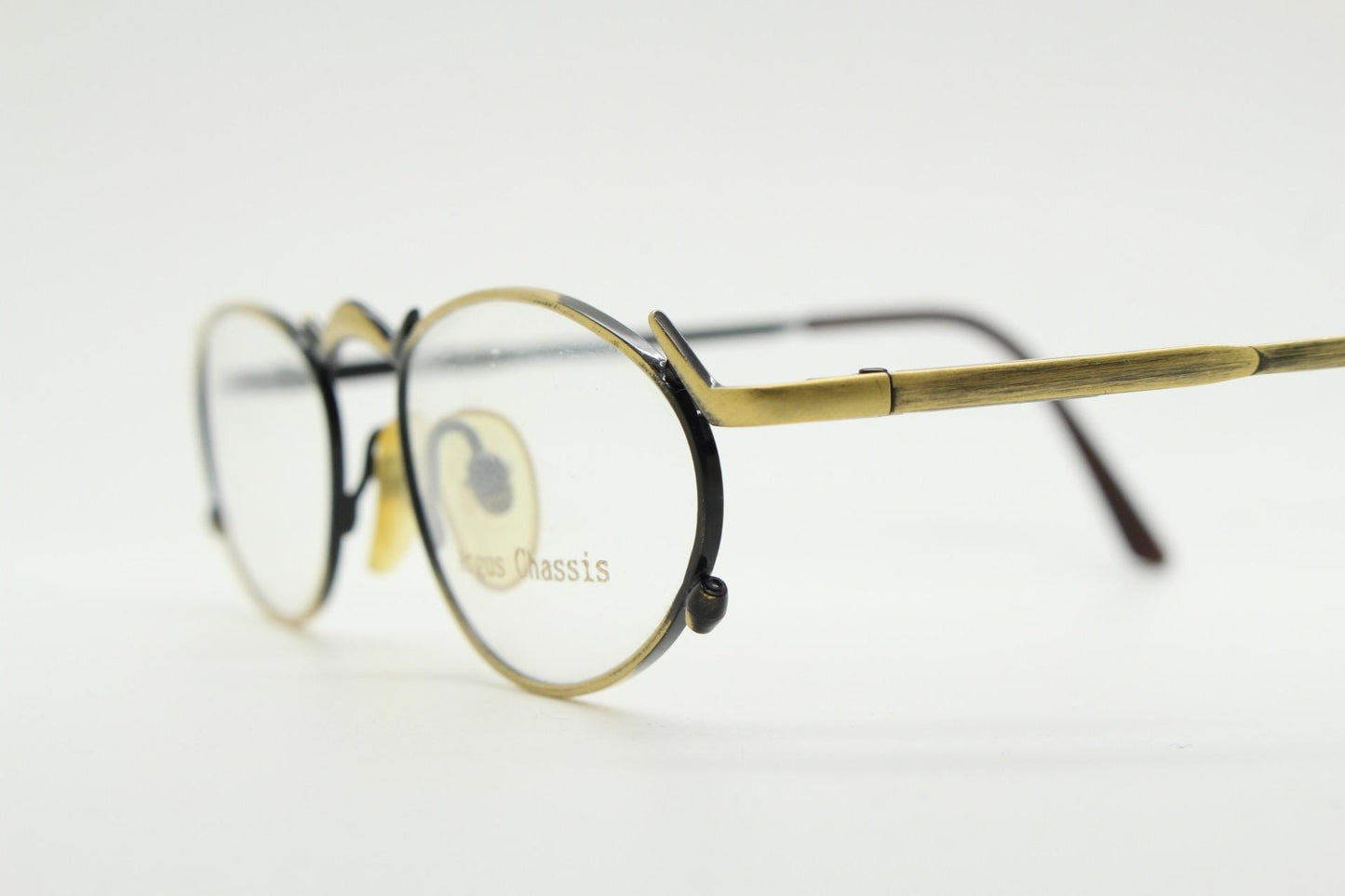 90s vintage oval eye glasses by Argus Chassis. Brushed bronze optical frames with dynamic spikes. Prescription cosplay fetish spectacles NOS