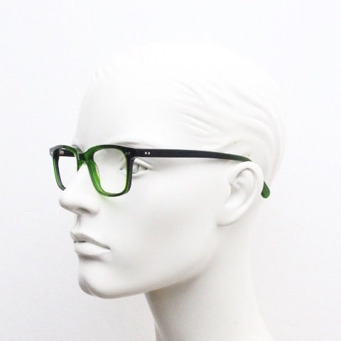 Green rectangular low profile wayfarer design eye glasses by found of Switzerland. Green gloss acetate optical frames. Prescription RX