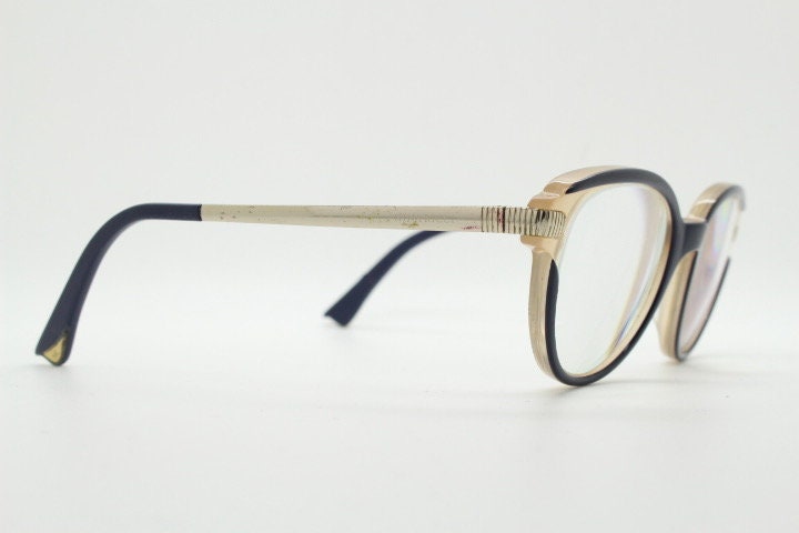 Nina Ricci vintage cat eye glasses. Yellow crystal and black acetate cateye optical frames gold metal arms. Womens prescription spectacles