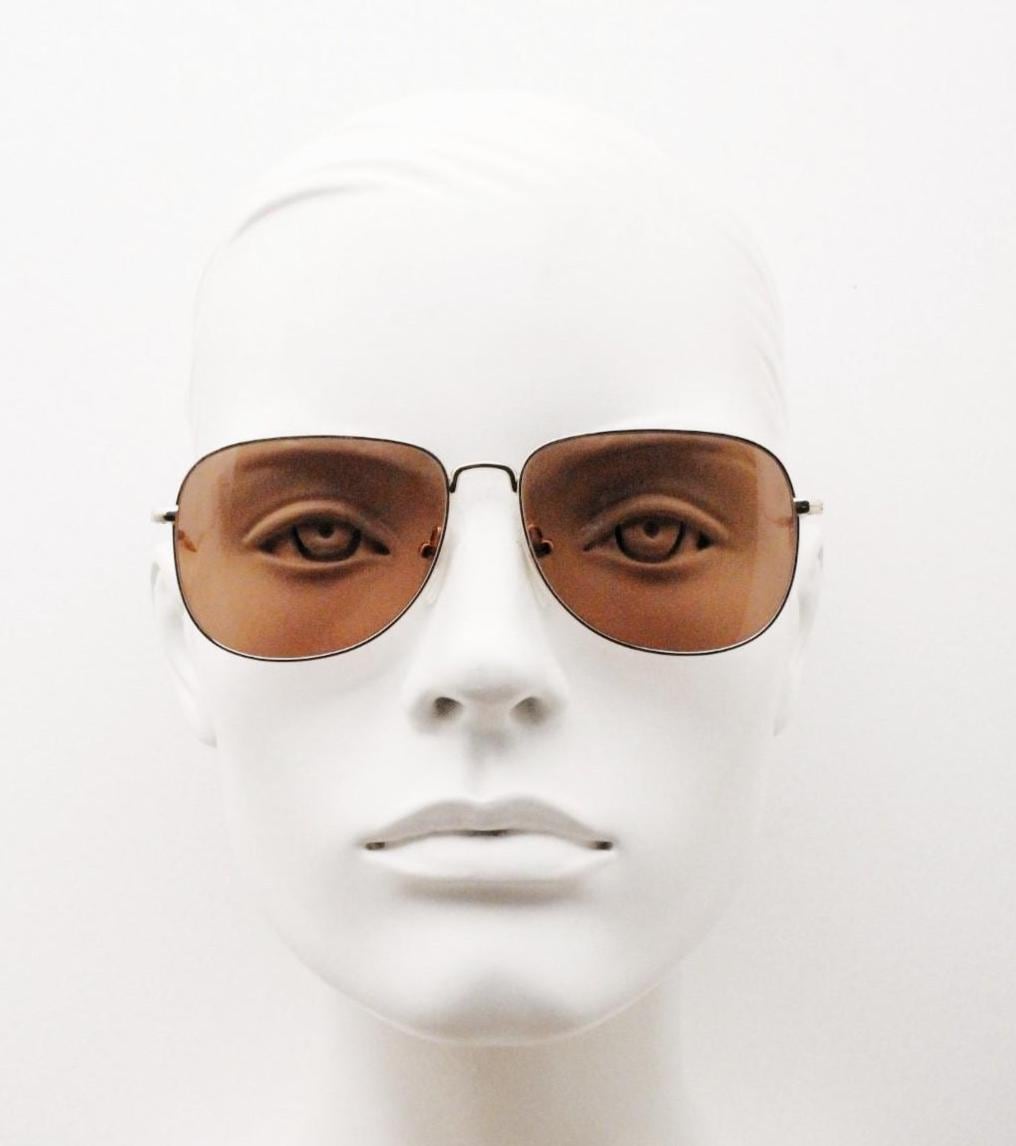Helmut Lang rectangular 90s vintage sunglasses made in Japan. Minimal gold chrome frame with warm brown lenses. Luxury modified aviator