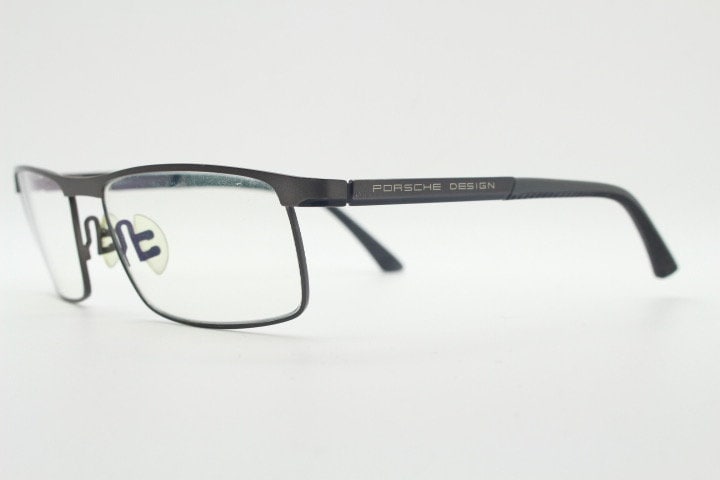 Porsche design rectangular eye glasses model 8251 made in Japan. Minimal gunmetal grey wire optical frame. Prescription RX spectacles