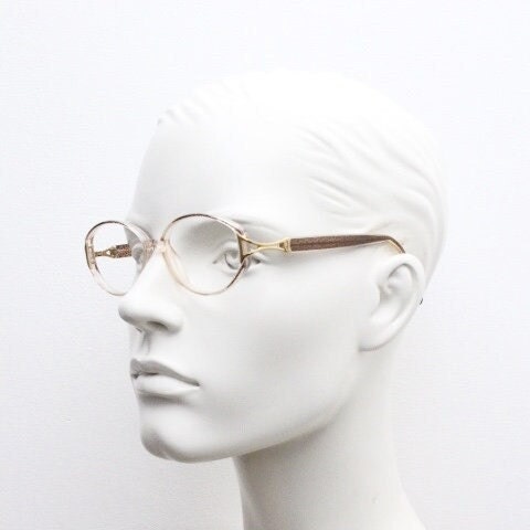Silhouette 80s vintage oval eye glasses made in Austria. Transparent crystal optical frame with giraffe arm print. Prescription RX