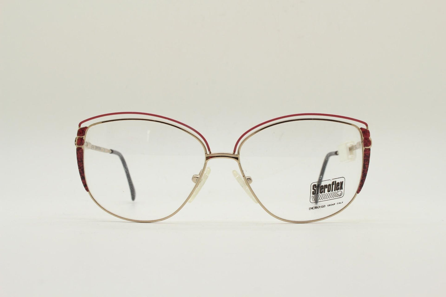 Luxottica 80s vintage gold metal eye glasses made in Italy. Inventive double brow with red highlights. Optical frame. Prescription NOS
