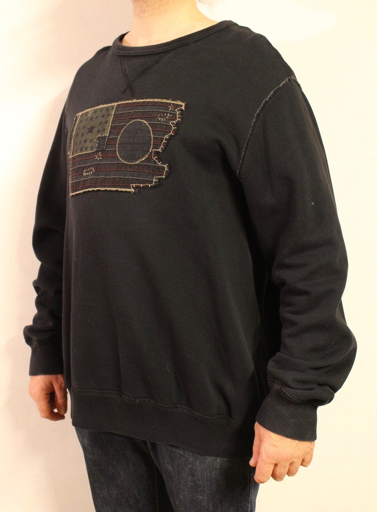 Ralph Lauren Polo Jeans Co. vintage sweatshirt. Black crew neck pullover with distressed US flag patch. Round neck jumper