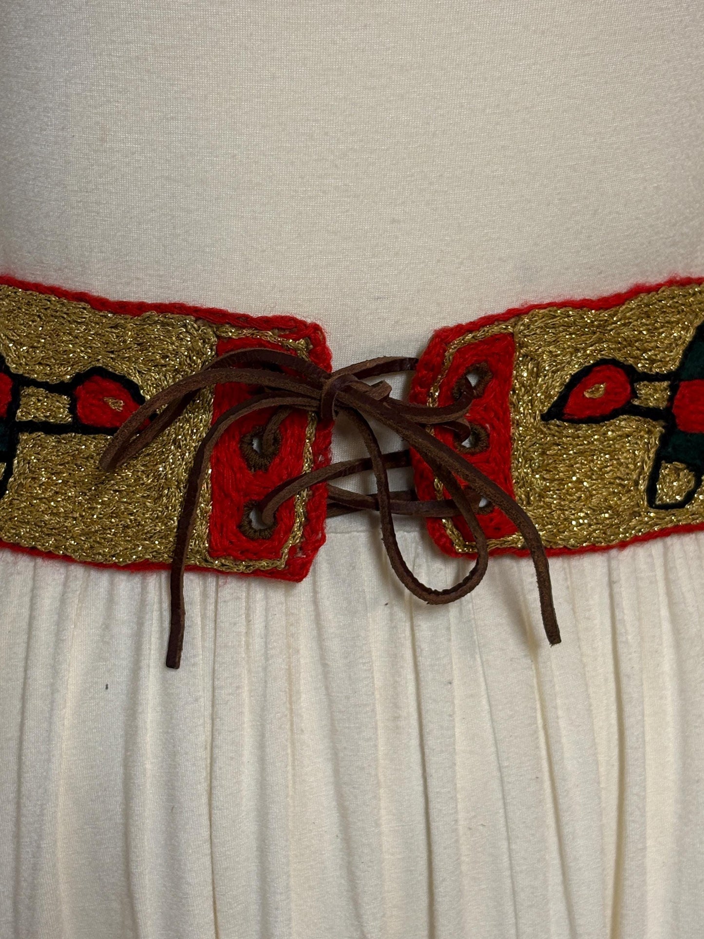 60s vintage completely hand made knitted belt. Embroidered sun, bird and abstract symbols with leather laced tie. Womens unique one off
