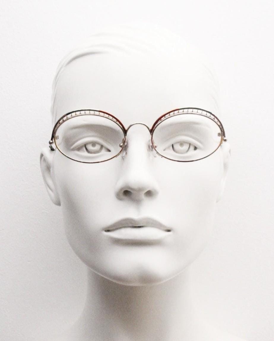 Casanova 80s vintage oval eye glasses. Incredible eyebrow canopy design with multi coloured finish. Optical frames. Prescription spectacles