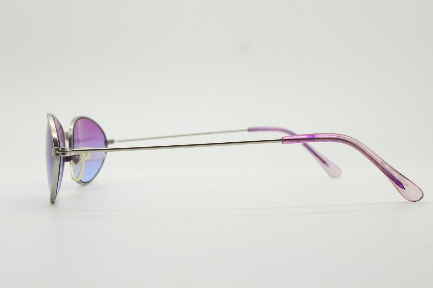 90s vintage small bug eye oval sunglasses. Silver satin frame with impressive pink to blue ombre graduating lenses. Y2K. 2000s. Unworn NOS