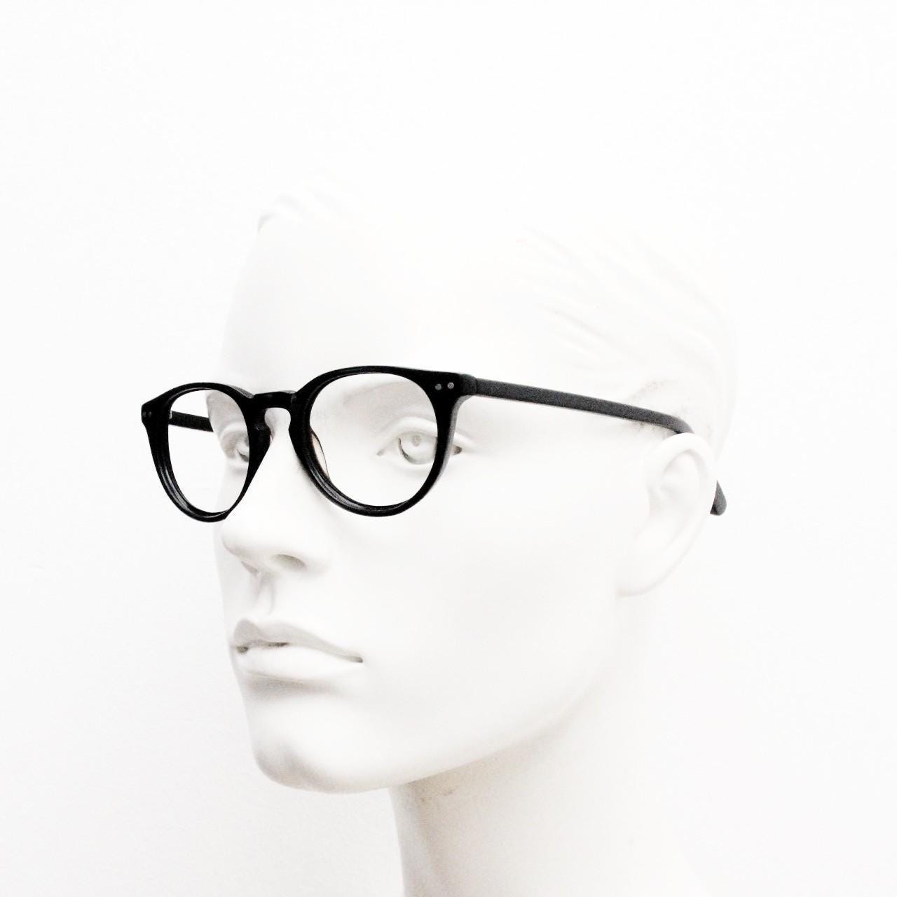 90s vintage oval eye glasses by Alles Brille of Germany. Classical black gloss acetate optical frames with keyhole bridge. RX Spectacles