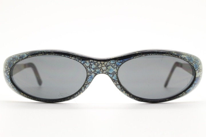 Killer Loop Shedevil 90s vintage shield sunglasses made in Italy. Low profile wrap around design with unique metallic print. One off sample
