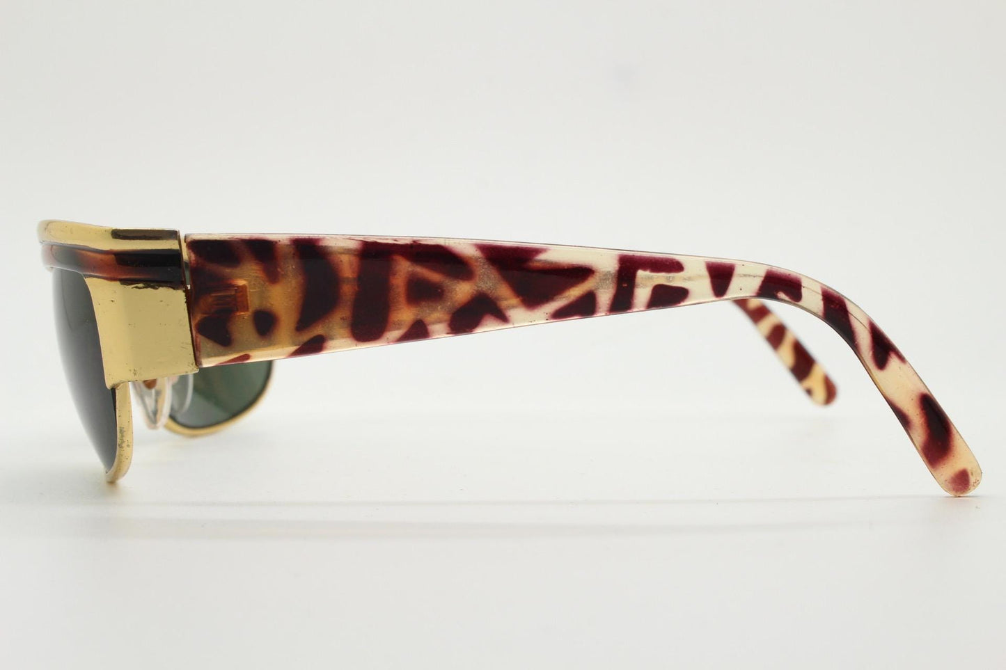 90s vintage visor shield sunglasses. Substantial metal curved wraparound frame with metallic tiger brow and abstract arm patterns. NOS. BNWT