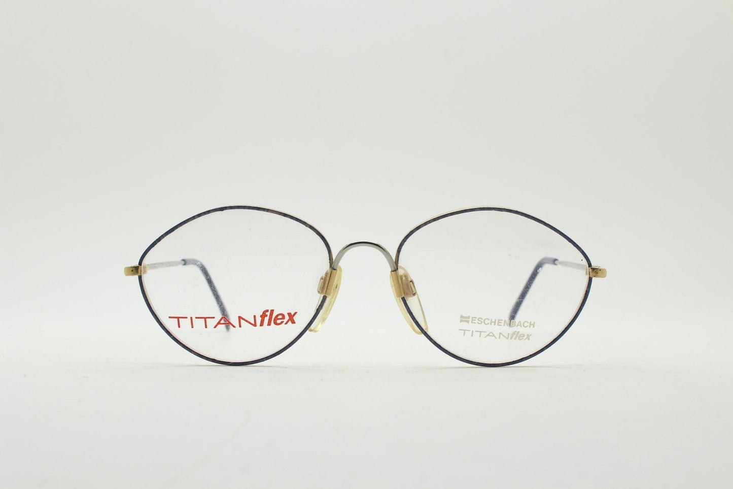 Eschenbach 90s vintage oval eye glasses made in Germany. Titanium optical frame with tasteful purple marbled front. Prescription NOS