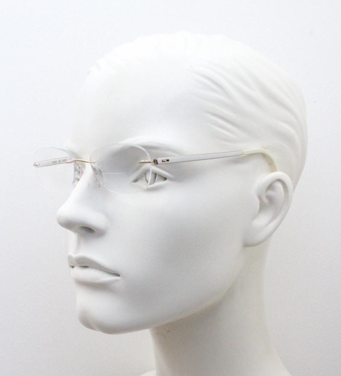 Silhouette rectangular frameless eye glasses made in Austria. Minimal lightweight gold with white enamel frame. 90s vintage. Prescription RX