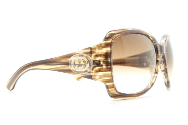 Gucci Y2K vintage oversized square sunglasses made in Italy. Transparent mottled brown frame with glitter sparkles and big stand out logo