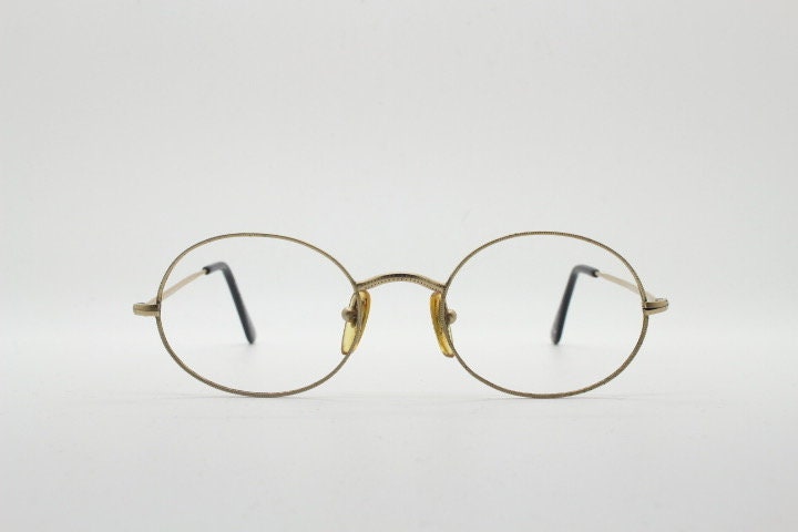 Giorgio Armani 90s vintage oval eye glasses made in Italy. 30s design gold optical frames in a satin finish. Prescription RX