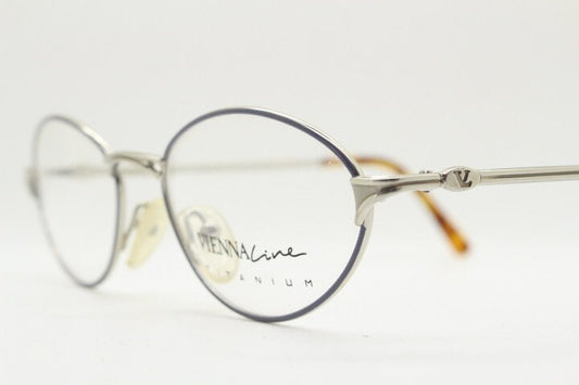 Viennaline 90s vintage oval eye glasses made in italy from titanium. Satin silver optical frame with grey enamel outline. Prescription RX