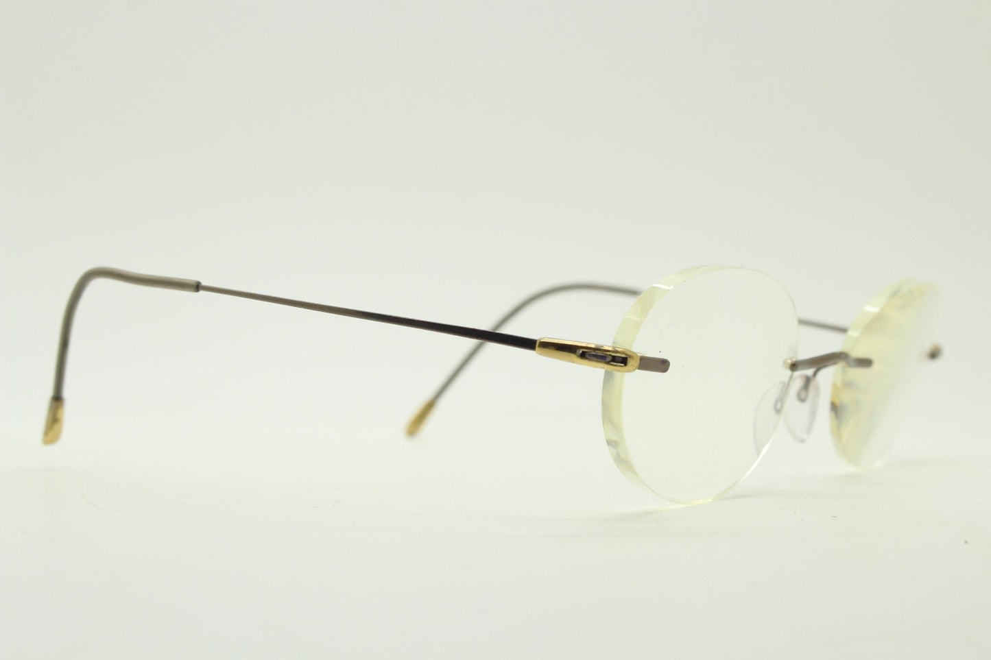 Silhouette vintage oval frameless eye glasses made in Austria. Minimal lightweight satin bronze optical frame. Prescription spectacles