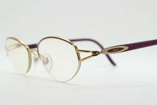 Silhouette oval half frame eye glasses model 6566 made in Austria. Minimal optical frame with gold trim deep purple arms. Prescription RX