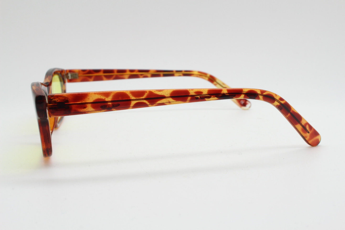 80s vintage rectangular sunglasses. Low profile 60s design tortoise frame with psychedelic light tone canary yellow lenses. BNWT Unused NOS