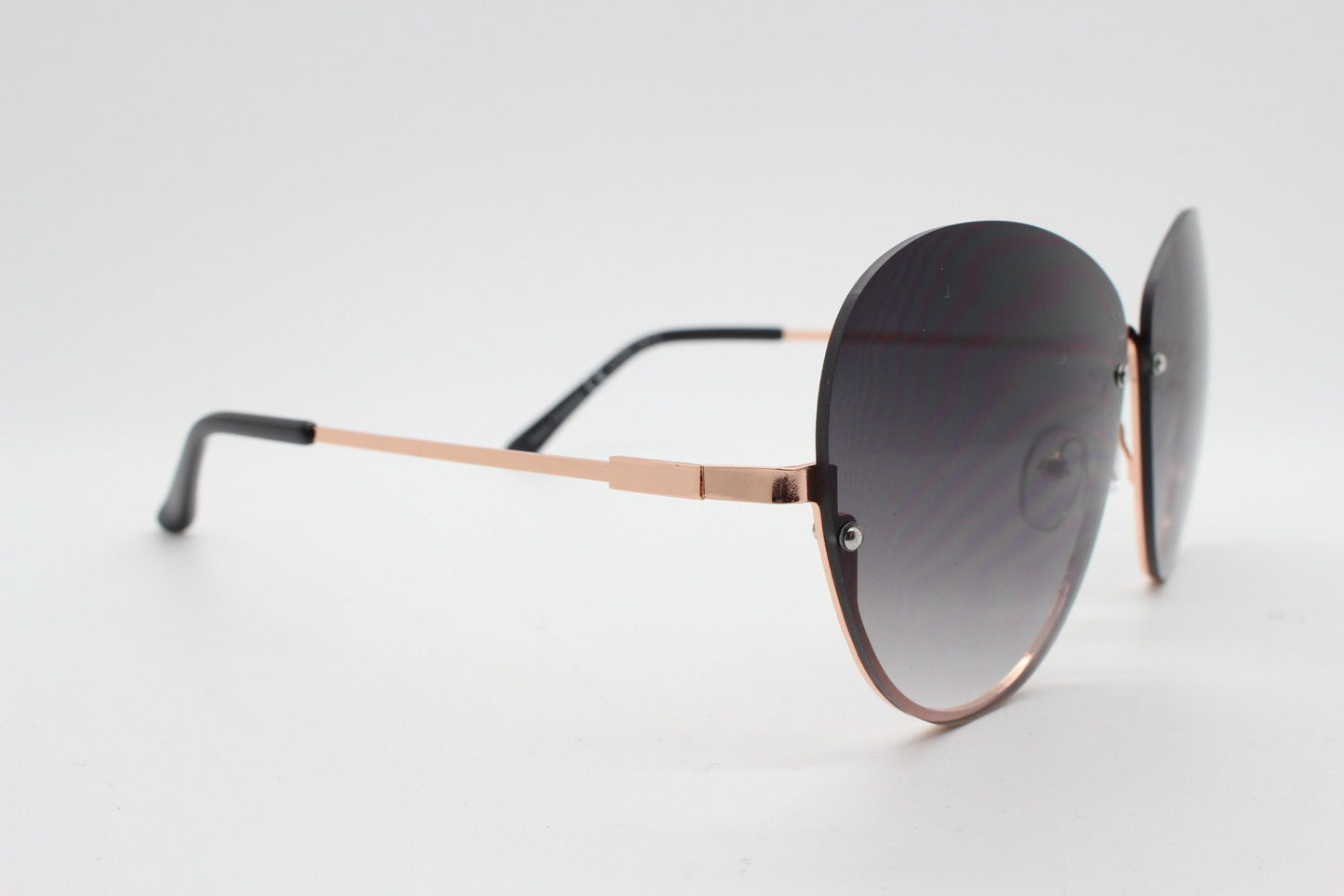 Y2K vintage large rimless sunglasses. Women's 70s style half frame design with graduating black lenses and gold arms. 2000s BNWT