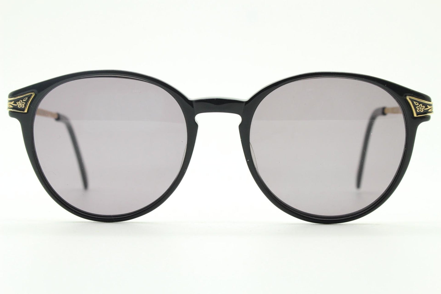 Laura Ashley 90s vintage round sunglasses. Refined 1940s design in black acetate with ornate embossed metal arm details. Unused NOS