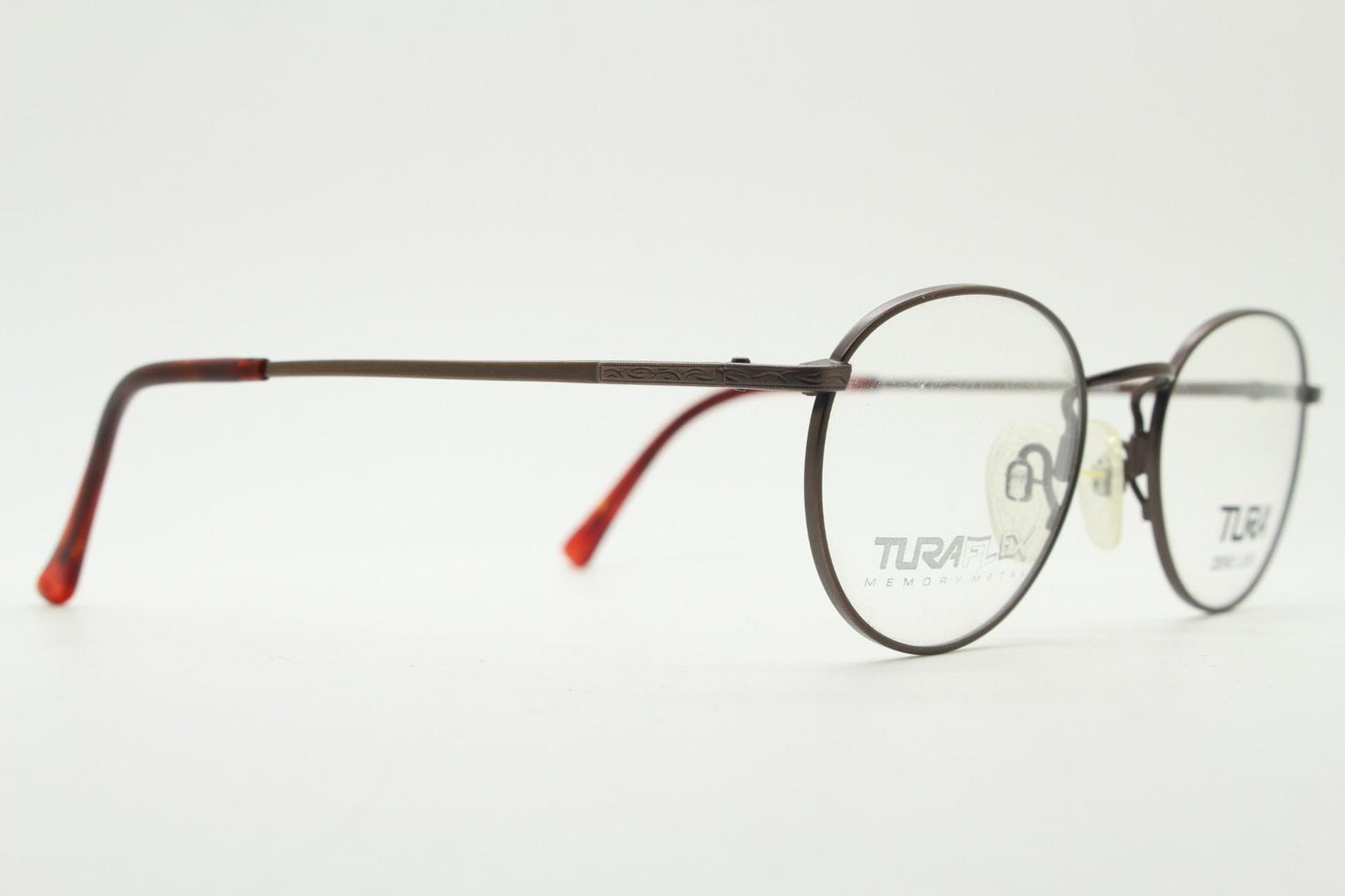 Tura 90s vintage oval eye glasses made in Japan. Satin metallic bronze finish optical frame in neat proportions. Prescription. Unused BNWT