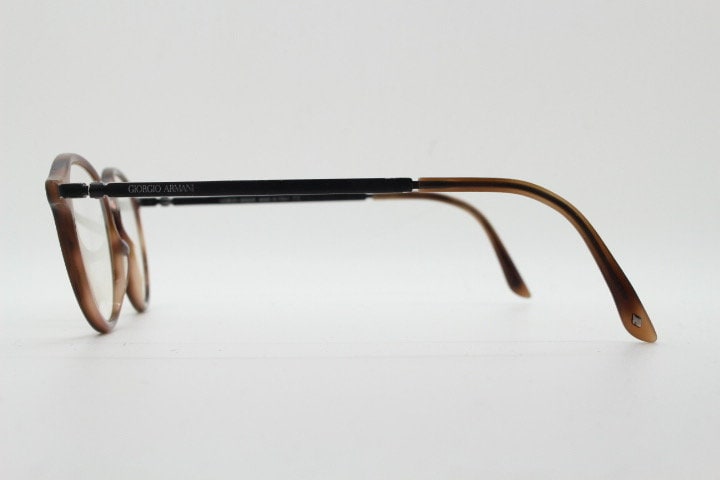 Giorgio Armani eye glasses model 7124 made in Italy. Mottled brown acetate optical frames with flat metal arms. Prescription eyeglasses. RX