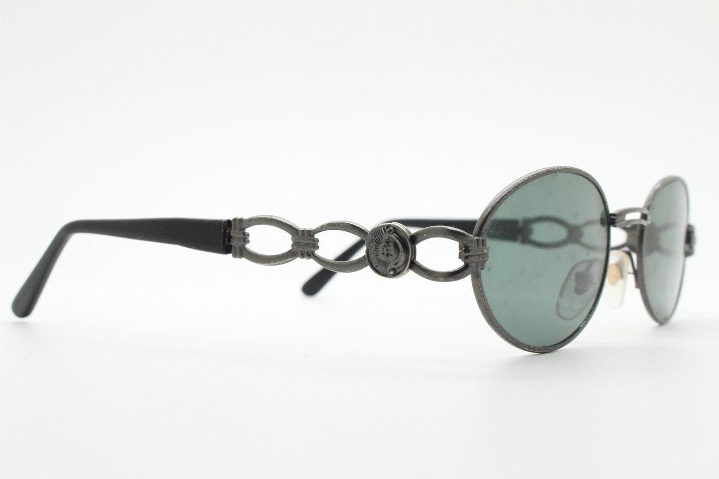 90s vintage low profile oval sunglasses. Authentic Gunmetal grey satin finish frame with chain link arm circles and real glass lenses. NOS