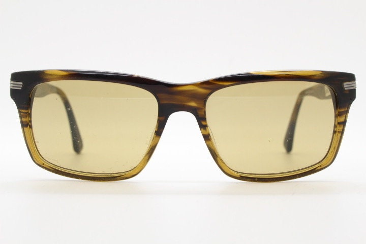 Oliver Peoples vintage rectangular sunglasses model Maceo. Handsome transparent mottled honey brown acetate frame with mid tone lenses