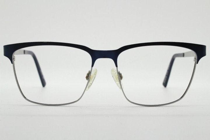 Karl Lagerfeld squared wayfarer shape eye glasses. Navy check pattern arms with satin finish brow optical frames. Prescription eyeglasses.