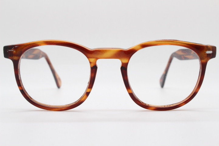 80s vintage modified wayfarer style glasses. Tortoise optical frames with keyhole bridge and clear lenses. 40s, 50s style NOS eyeglasses