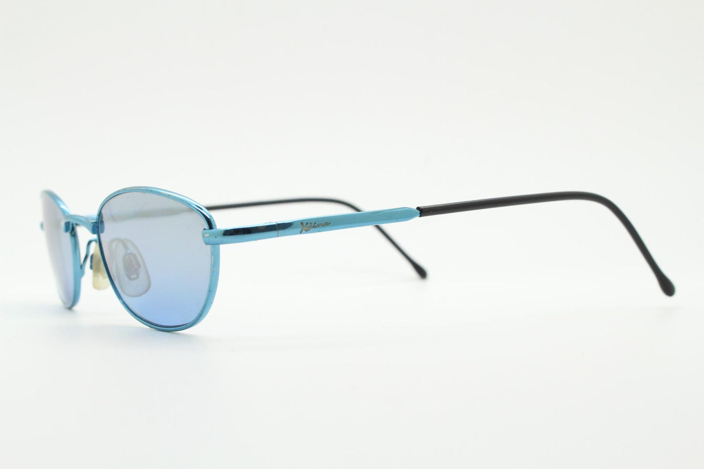 90s vintage small oval sunglasses by X-line. Unusual blue chrome metal frame with well matched mirror lenses. Quality NOS
