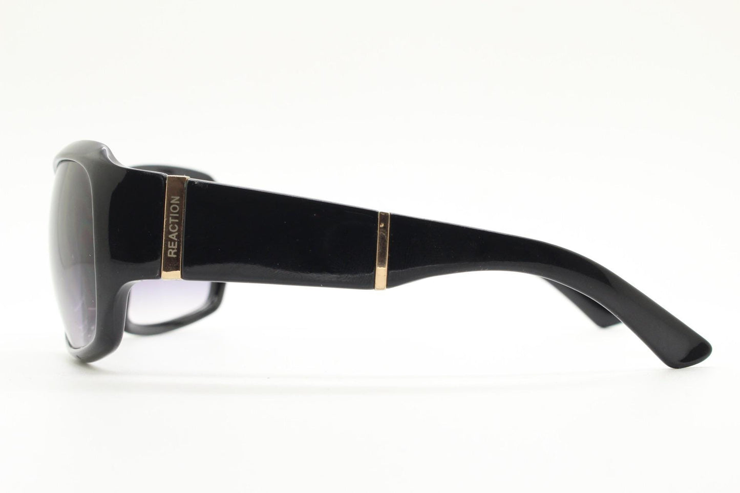 Y2k vintage wrap around sunglasses by Kenneth Cole Reaction. Curved black shield frame with gold trim. 60s bug eye design. 2000's NOS