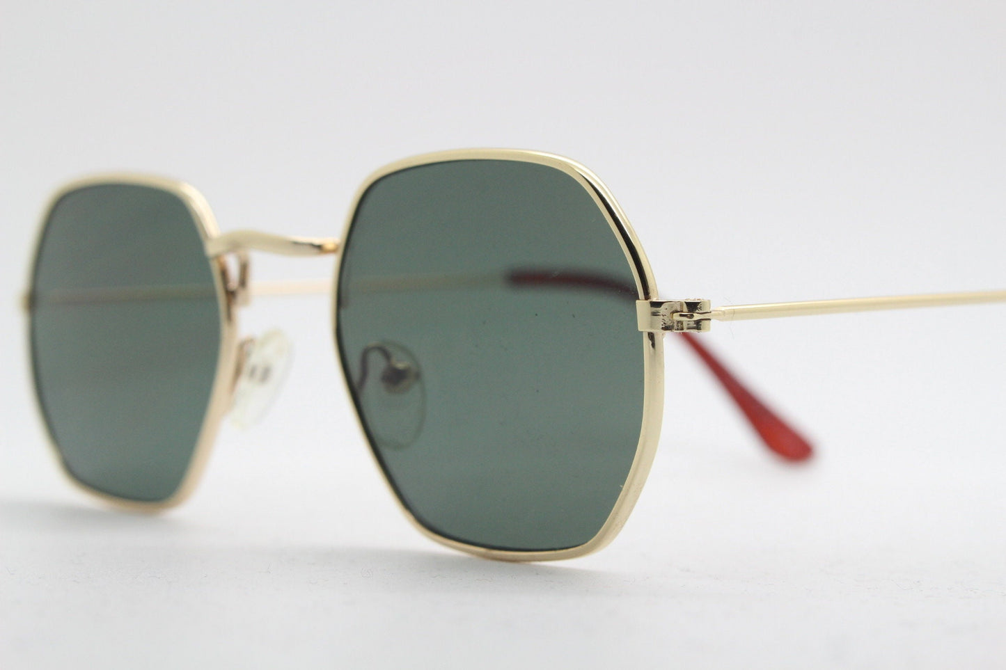 90s vintage hexagon sunglasses. Low profile slim gold 60s design frame with flat green lenses Octagon