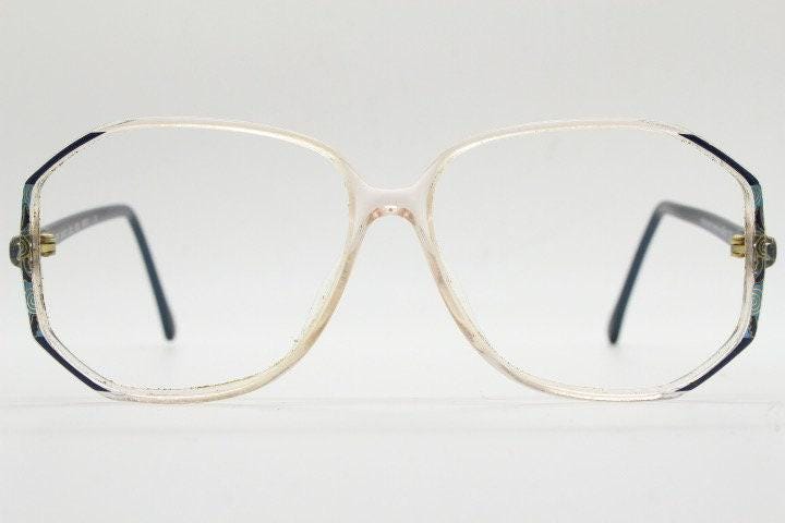 Silhouette 80s vintage hexagon eye glasses made in Austria. Transparent crystal optical frame with abstract blue pattern. Prescription. 70s