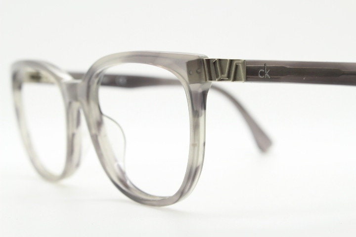 Calvin Klein rectangular eye glasses. Unisex transparent grey gloss acetate optical frames. Prescription eyeglasses. RX spectacles