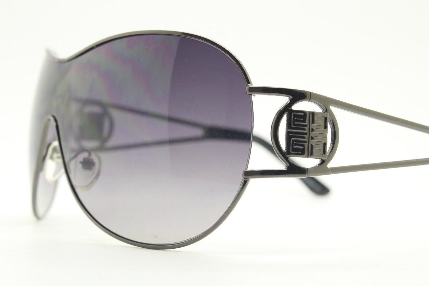 Y2K vintage futuristic visor sunglasses. 2000's black wraparound mono lens mini mask shield design with target temple crest. 00's NOS