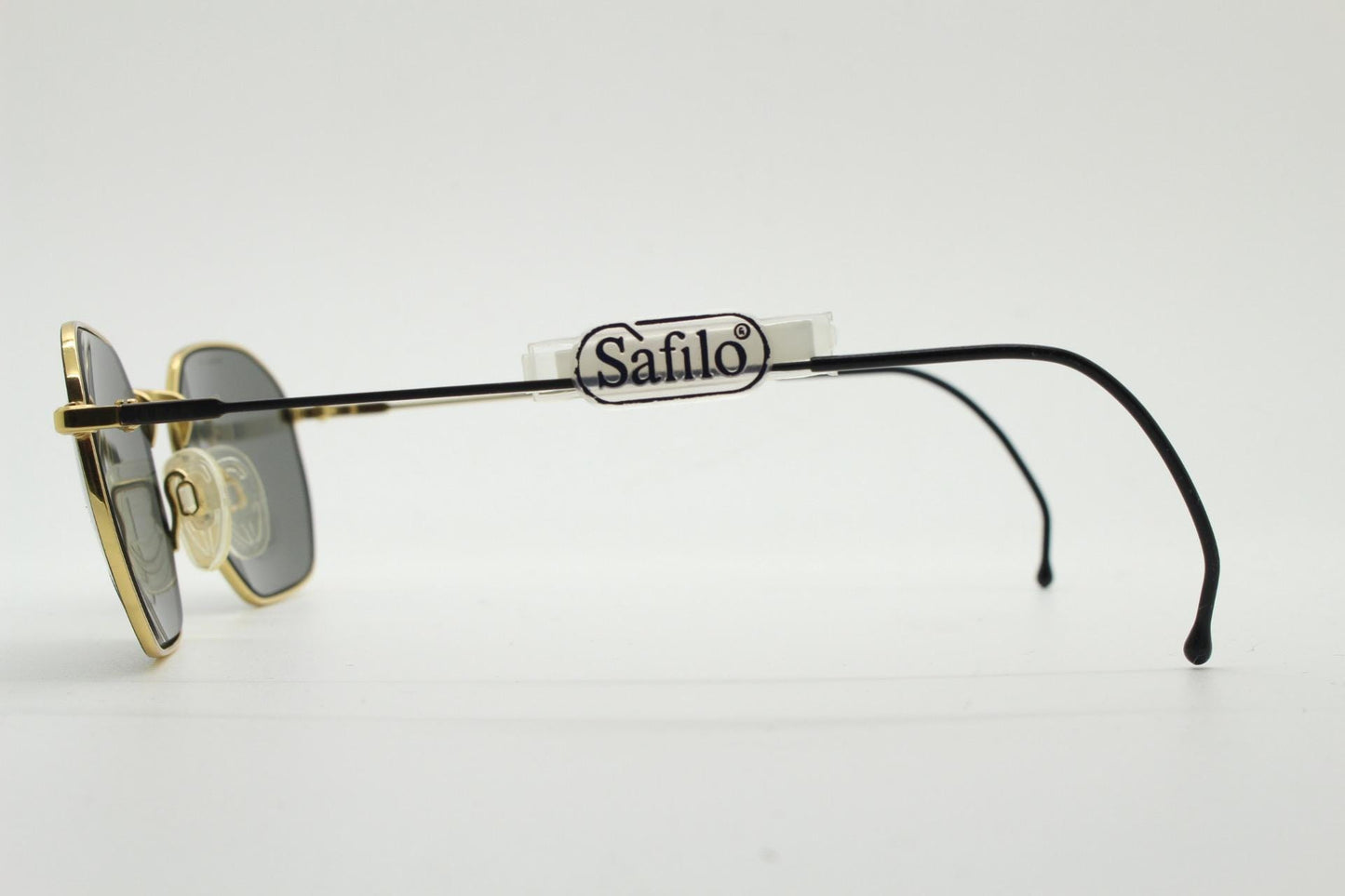 Safilo 90s vintage angled rectangular sunglasses made in Italy. Flexible black wire  metal frame with gold trim and green lenses. BNWT NOS