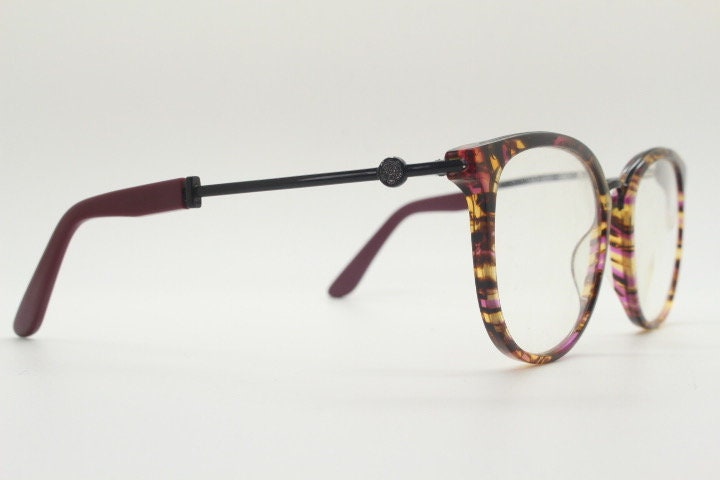 Kenzo vintage round eye glasses made in France. Tortoise with purple tones and matching arm sections. Womens Prescription Optical frames. RX