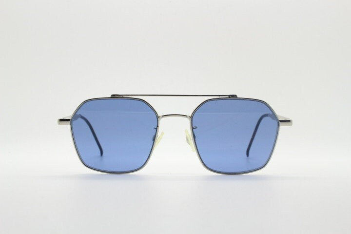 Tommy Hilfiger square aviator sunglasses with double bridge. Silver metal 6 sided frame aviators with blue lenses. Hexagon
