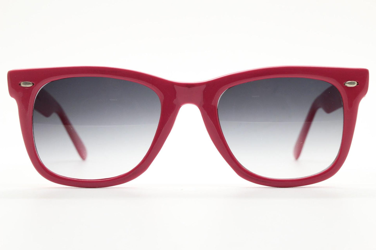 Vintage Y2K wayfarer design sunglasses. All time classic design in glossy pink with graduating smoky black lenses. Excellent NOS condition