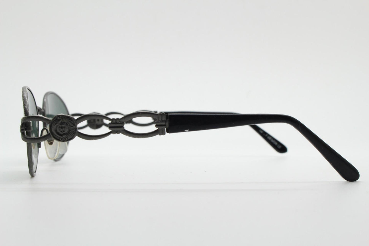 90s vintage low profile oval sunglasses. Authentic Gunmetal grey satin finish frame with chain link arm circles and real glass lenses. NOS