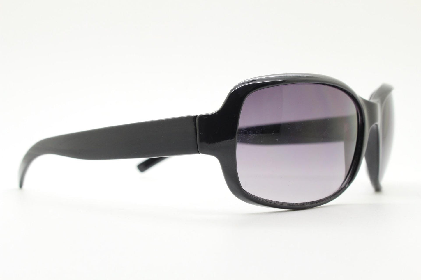 Y2k vintage wrap around rectangular sunglasses. Curved black gloss frame with graduating grey lenses. 2000's bug eye. NOS