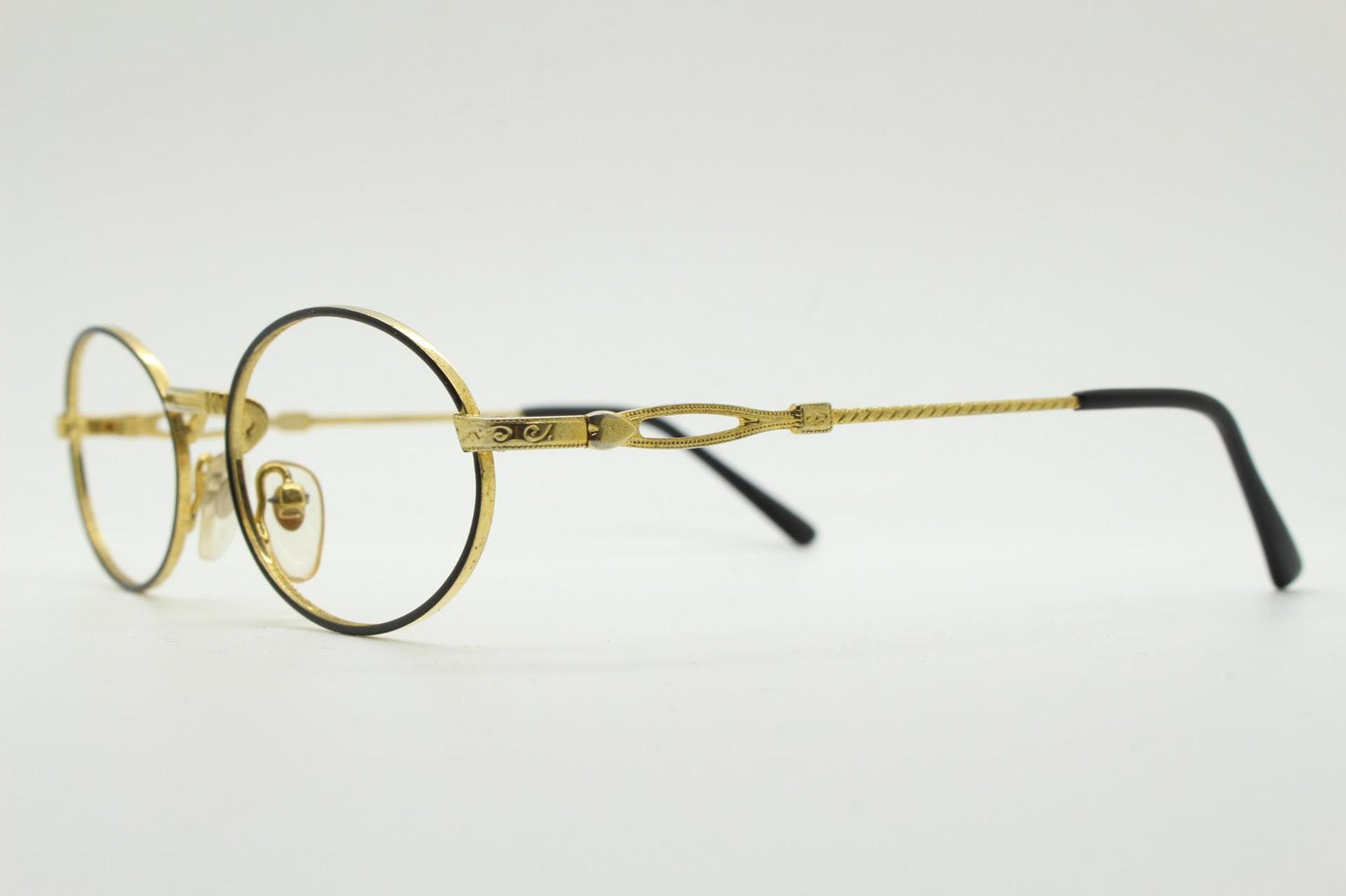 90s vintage small oval eye glasses. Gold and black optical frames with ornate arm details. Prescription RX steampunk spectacles. NOS