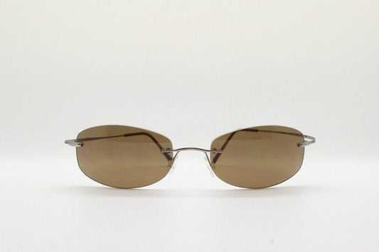 Faconnable 90s vintage sunglasses model 859 hand made in Italy. Minimal frameless design with flexible wire arms and brown chrome trim. NOS
