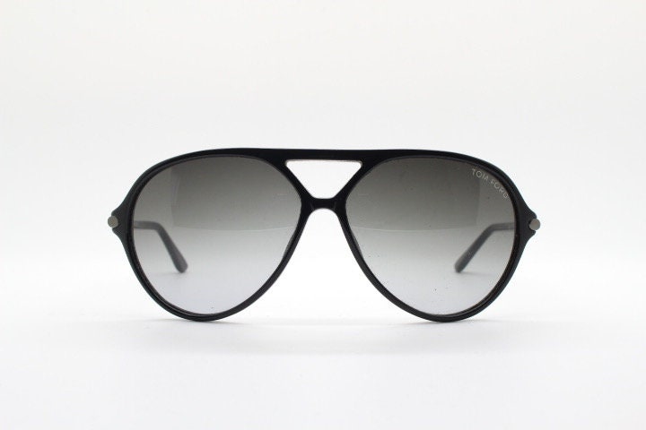 Tom Ford vintage black aviator sunglasses made in Italy. Classic teardrop pilot design in gloss acetate with graduating lenses