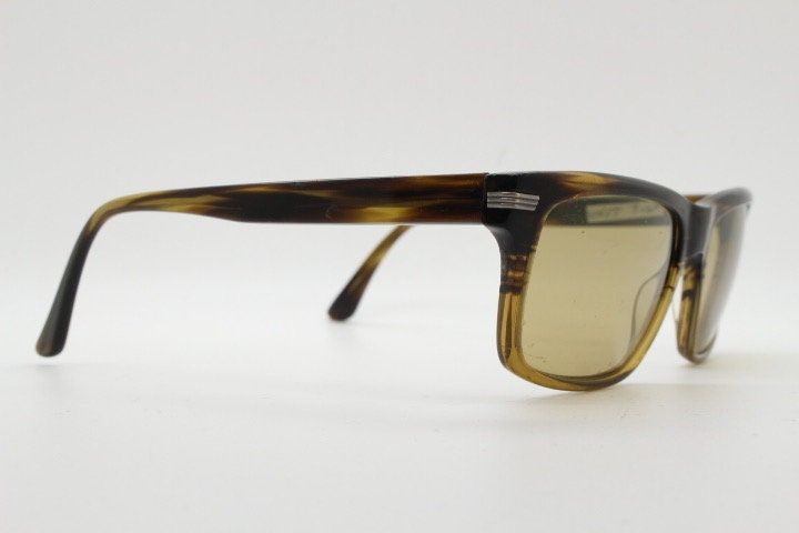Oliver Peoples vintage rectangular sunglasses model Maceo. Handsome transparent mottled honey brown acetate frame with mid tone lenses