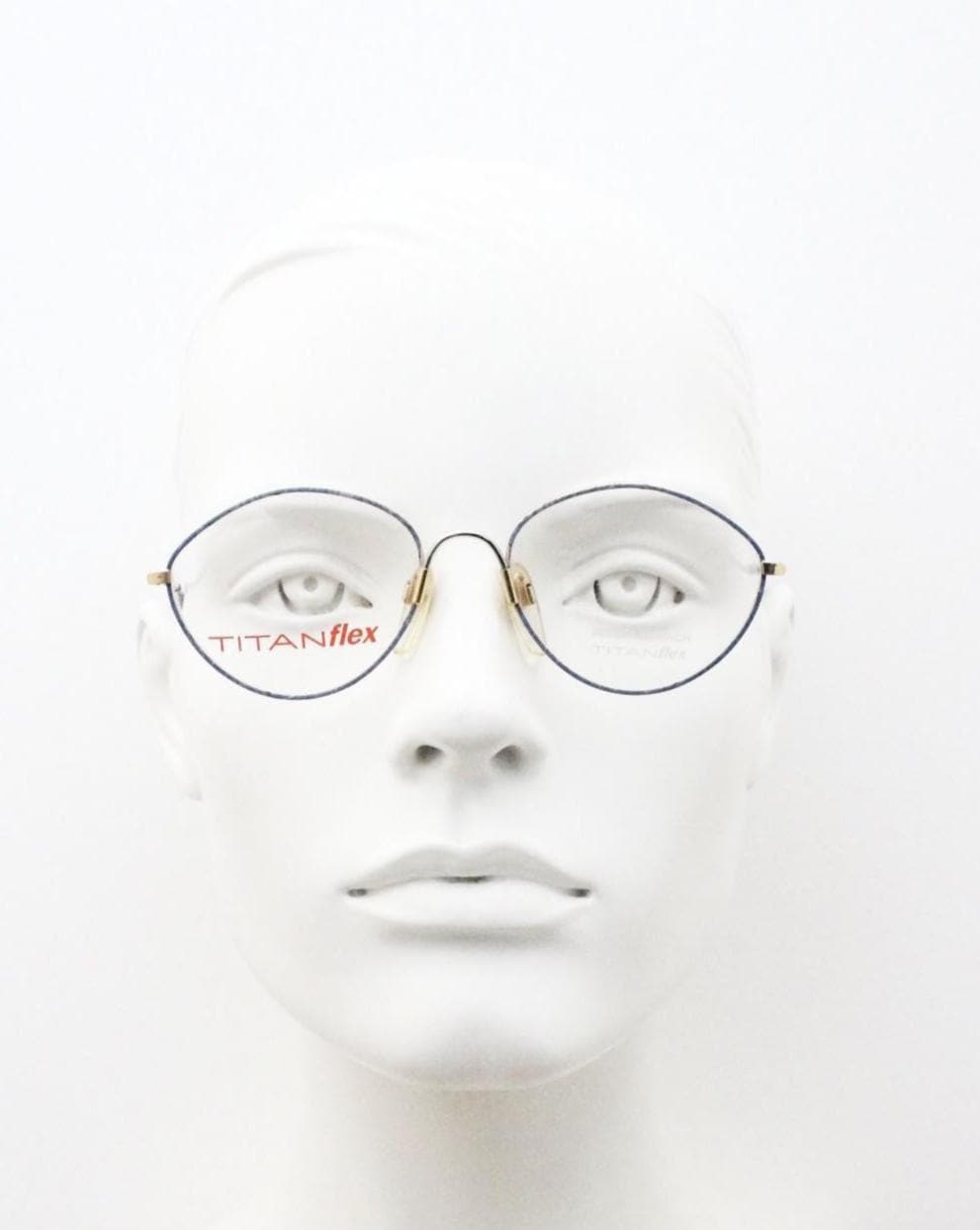 Eschenbach 90s vintage oval eye glasses made in Germany. Titanium optical frame with tasteful purple marbled front. Prescription NOS